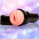 A close-up of the Fleshlight GO Surge - Vagina by Fleshlight, a travel-sized stroker made with lifelike SuperSkin material.